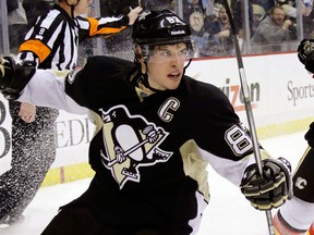 Pittsburgh's Sidney Crosby celebrates his second-period goal against the Calgary Flames in Pittsburgh Saturday. (AP Photo/Gene J. Puskar)