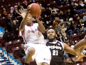 Windsor Express guard Stefan Bonneau, left, drives to the basket against the Mississauga Power at the WFCU Centre Saturday, (JOEL BOYCE/The Windsor Star)