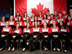 The 21 players who were named to Canada's national women's hockey team pose for a team photo Monday. Ruthven's Meghan Agosta-Marciano is in the front row, second from right. (THE CANADIAN PRESS/Jeff McIntosh)