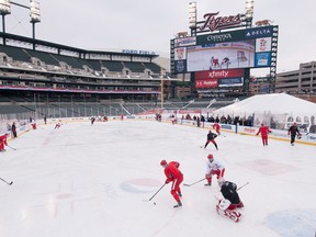 The Detroit Red Wings practise on the the outdoor hockey rink at Comerica Park where the Spitfires will play Sunday. (AP Photo/Detroit News, David Guralnick)