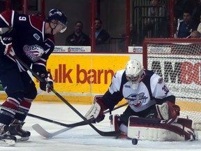 Saginaw's Justin Kea, left, is stopped by Windsor goalie Dalen Kuchmey at the WFCU Centre Saturday. (JOEL BOYCE/The Windsor Star)