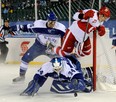 Grand Rapids forward Martin Frk, right, flies over the top of the net as Toronto goalie Drew MacIntyre makes a save at the AHL outdoor game at Comerica Park. (AP Photo/Detroit News, David Guralnick)