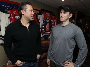 Spits GM Warren Rychel, left, and his Kerby Rychel are photographed Tuesday night after Warren traded his son to the Guelph Storm. (TYLER BROWNBRIDGE/The Windsor Star)