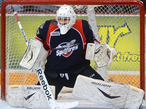Spitfires goaltender Alex Fotinos makes a save against the Guelph Storm in Guelph. (Tony Saxon/Guelph Mercury)