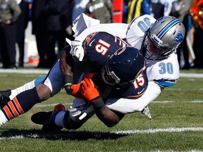 Detroit's Darius Slay, right, tackles Chicago's Brandon Marshall in Chicago. (AP Photo/Charles Rex Arbogast)