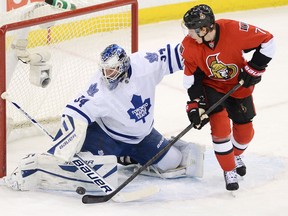 Ottawa's Kyle Turris, right, is stopped by Toronto goalie James Reimer during first-period NHL action in Ottawa. (THE CANADIAN PRESS/Sean Kilpatrick)