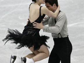 Canadians Tessa Virtue, left, and Scott Moir compete in the Ice Dance Short Dance during day two of the ISU Grand Prix of Figure Skating Final Friday in Fukuoka, Japan.  (Photo by Chris McGrath/Getty Images)