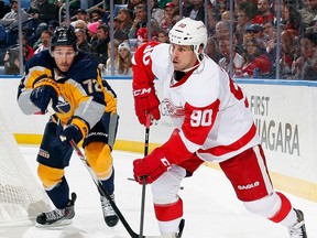 Detroit's Stephen Weiss, right, is checked by Buffalo's  Luke Adam at First Niagara Center in Buffalo. (Photo by Jen Fuller/Getty Images)