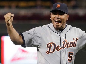 Detroit pitcher Joaquin Benoit celebrates after striking out Minnesota's Josh Willingham. A report says the San Diego Padres have signed the closer to a $15.5-million, two-year contract. (AP Photo/Jim Mone, File)