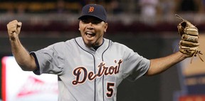 Detroit pitcher Joaquin Benoit celebrates after striking out Minnesota's Josh Willingham. A report says the San Diego Padres have signed the closer to a $15.5-million, two-year contract. (AP Photo/Jim Mone, File)
