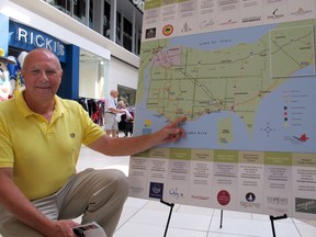 Tom O’Brien, co-owner of Cooper’s Hawk Vineyards, points to his winery on a new wine route map unveiled on Friday, July 13, 2012. O'Brien and other vintners in the area are bracing for a cold snap on Monday that may damage their grape vines. (Monica Wolfson/The Windsor Star)