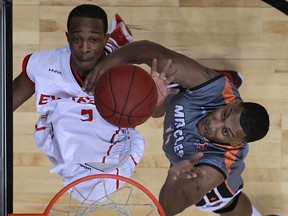 Windsor's Stefan Bonneau, top, battles for a rebound with Moncton's Anto Raic as the Windsor Express host the Moncton Miracles at the WFCU Centre, Sunday, Dec. 8, 2013.  Windsor defeated Moncton 115-101.  (DAX MELMER/The Windsor Star)