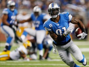 Detroit's Calvin Johnson runs for a touchdown against Green Bay November 28, 2013 in Detroit. The Lions host the Baltimore Ravens Monday night. (Gregory Shamus/Getty Images)