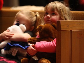 Emma-Lee Williams and Madisyn Burke (right) attend the Teddy Bear Christmas eve service at Emmanuel United Church in Windsor on Tuesday, December 24, 2013.                    (TYLER BROWNBRIDGE/The Windsor Star)