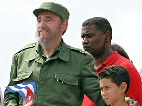 Cuban President Fidel Castro, left,  poses with shipwreck survivor Elian Gonzalez, whose custody battle morphed into a US-Cuban political wrestling match, after presiding over a massive May Day demonstration at Havana's Plaza de la Revolucion on May 1, 2005. (ADALBERTO ROQUE/AFP/Getty Images)