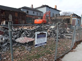 Demolition work begins at 1271 Riverside Dr. East — once remembered as the John Davis House, and later known as adult entertainment venue Danny's Tavern. Photographed Dec. 2, 2013. (Jason Kryk / The Windsor Star)