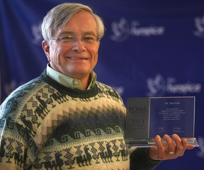 Jim Gall poses with the Glenn Sawyer Service Award he recently received from the Ontario Medical Association. (DAN JANISSE/The Windsor Star)