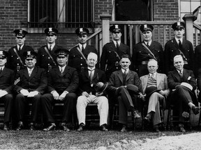 The East Windsor police force was praised by County Judge J. J. Coughlin, following an inspection of the force at the East Windsor City Hall on June 7, 1930. Members of the police department, decked out in new uniforms, are shown in the picture above, together with members of the East Windsor police commission. Front row, left to right: Sergeant Frank H. Ingram, Sergeant Emile Lefaive, Chief Albert Maisonville, Magistrate W. A. Smith, Mayor John B. Wigle, County Judge J. j. Coughlin, Crown Attorney James S. Allan, Inspector Charles Johnson, Sergeant John Mahoney. Back row, left to right: Traffic Officer Fred Tellier, Constable Edward MacFarlane, Constable Reginald LaBelle, Constable George Renaud, Constablle Edward LePage, Constable William Mullins, Constable James Keelan, Constable Clarence MacPhedran, Constable William Langlois, and Traffic Officer Hector Rivers. (FILES/The Windsor Star)