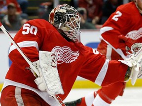 Wings goalie Jonas Gustavsson makes a save during the first period against the Calgary Flames, Thursday, Dec. 19, 2013, in Detroit. (AP Photo/Duane Burleson)