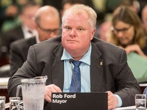 Mayor Rob Ford attends an executive committee meeting at Toronto's City Hall on Thursday, December 5 2013. Ford says he didn't intend to suggest a Toronto Star reporter is a pedophile during a televised interview with Conrad Black. Reporter Daniel Dale served Ford with a libel notice last week, demanding the mayor apologize for and retract what Dale called a "false insinuation." (THE CANADIAN PRESS/Chris Young)