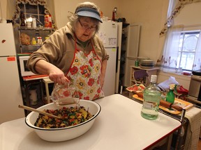 Mary Ann Cuderman prepares fruitcake at the Olde Towne Bake Shop in Windsor. (TYLER BROWNBRIDGE / The Windsor Star)