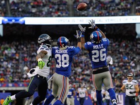 Giants strong safety Antrel Rolle, right, makes an interception against the Seahawks at MetLife Stadium on December 15, 2013 in East Rutherford, New Jersey. (Ron Antonelli/Getty Images)