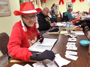 The Windsor Goodfellows were busy handing out their annual Christmas baskets, Thurs. Dec. 19, 2013. Volunteer Freida Parker Steele was decked out in her seasonal outfit as she handle some administrative duties. (DAN JANISSE/The Windsor Star)