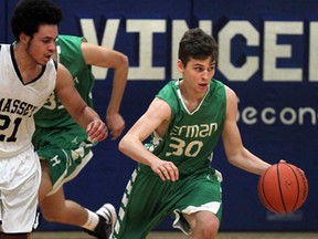 Massey's Donny Ballentyne, left, chases Herman's Stefan Pupovcic at Massey gym Tuesday December 10, 2013. (NICK BRANCACCIO/The Windsor Star)