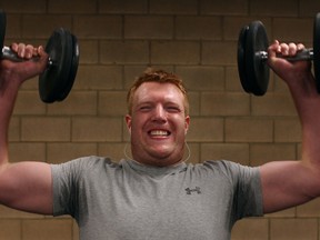Peter Curran, 22, from Windsor, lifts weights at Windsor Squash and Fitness this week. (DAX MELMER / The Windsor Star)