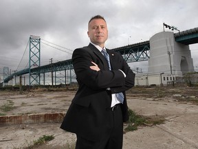 ATF special agent Brian Beardsley poses Friday, Sept. 13, 2013, in front of the Ambassador Bridge in Detroit, MI. Beardsley was instrumental in busting a massive international gun smuggling operation. (DAN JANISSE/The Windsor Star)