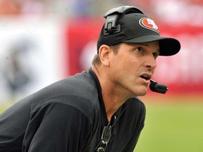 San Francisco coach Jim Harbaugh watches play against the Buccaneers December 15, 2013 in Tampa, Fla. (Al Messerschmidt/Getty Images)