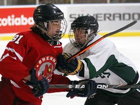 Brennan's Nathan Zakoor, left, battles Belle River's Riley Meyerink during the Southern Ontario High School Hockey Classic at the WFCU Tuesday December 17, 2013.  (NICK BRANCACCIO/The Windsor Star)