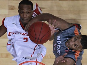 Windsor's Stefan Bonneau, top, battles for a rebound with Moncton's Anto Raic as the Windsor Express host the Moncton Miracles at the WFCU Centre, Sunday, Dec. 8, 2013.  Windsor defeated Moncton 115-101.  (DAX MELMER/The Windsor Star)