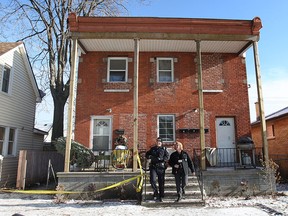 Windsor police investigate a shooting, Tues. Dec. 10, 2013, at a fourplex at 818 Langlois Ave. in Windsor, Ont. A man was shot at one of the lower units Mon. Dec. 9, 2013, at approximately 9:30 p.m. (DAN JANISSE/The Windsor Star)