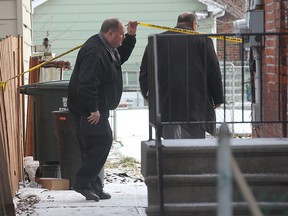 Windsor police investigate a shooting, Tues. Dec. 10, 2013, at a fourplex at 818 Langlois Ave. in Windsor, Ont. A man was shot at one of the lower units Mon. Dec. 9, 2013, at approximately 9:30 p.m. (DAN JANISSE/The Windsor Star)