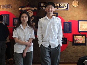 Holy Names Catholic  high school students Juejie Pan, 17, left, and Zuwei Li, 19, for story on the WECDSB and international students. (JASON KRYK/The Windsor Star)