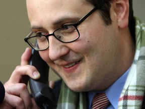 Irek Kusmierczyk smiles as he talks to Mayor Eddie Francis  on the phone after winning the Ward 7 byelection at the WFCU Centre in Windsor on Monday, December 9, 2013.    (TYLER BROWNBRIDGE/The Windsor Star)