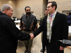Irek Kusmierczyk is greeted by Councillor Ed Sleiman after winning the Ward 7 byelection at the WFCU Centre in Windsor on Monday, December 9, 2013.                  (TYLER BROWNBRIDGE/The Windsor Star)