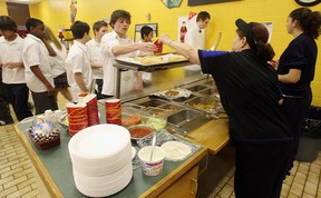 In this file photo, staff served students in the cafeteria of Holy Names on January 21, 2010 before the provincewide ban on unhealthy foods in schools. (TYLER BROWNBRIDGE / The Windsor Star)