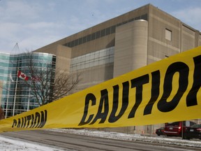 Caution tape hangs across a closed parking lot at the Kellogg's Canada plant  in London. (THE CANADIAN PRESS/Dave Chidley)