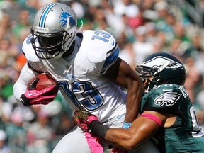 Lions receiver Nate Burleson, left, is wrapped up by Eagles linebacker Mychal Kendricks last season in Philadelphia. The Eagles host the Lions Sunday (1 p.m., Fox). (AP Photo/The Wilmington News-Journal, Andre L. Smith)