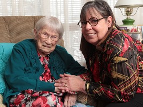 102 year-old Margaret Chamney and her neighbour Penny Gallagher are searching for Chamney's lost prayer book.  Chamney's book was accidentally thrown out. (JASON KRYK/The Windsor Star)