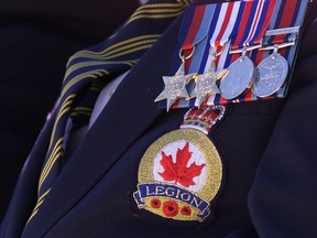 A member of the Royal Canadain Legion proudly displays his medals Sunday a ceremony at the Windsor Cenotaph. (Windsor Star files)