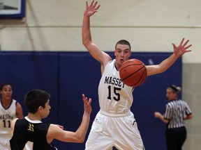 Massey's Justin Lalonde, right, attempts to block a pass against Riverside's Patrick Charter during boys high school basketball Friday Dec. 6, 2013. Lalonde had multiple blocks in the game. (NICK BRANCACCIO/The Windsor Star)