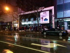 Dozens line up along Ouellette Avenue on Friday, Dec. 20, 2013 for the annual Mikhail Holdings turkey giveaway. (Twitpic)