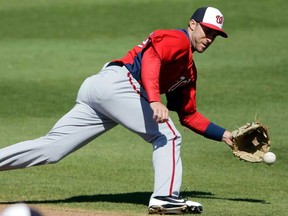Washington's Steve Lombardozzi chases down a single by Philadelphia during an exhibition game in Clearwater, Fla. The Detroit Tigers have traded starting pitcher Doug Fister to the Nationals for three players, one of which is Lombardozzi. (AP Photo/Matt Slocum, File)