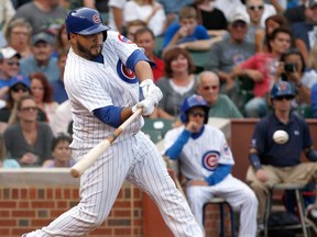 Chicago's Dioner Navarro hits a home run off Atlanta Sept. 20, 2013, in Chicago. (THE CANADIAN PRESS/AP/Charles Rex Arbogast)