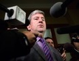 Glen Murray Ontario's Minister of Transportation, talks with media after Premier Kathleen Wynne was presented with the transit investment report by Anne Golden, chair of the transit investment strategy advisory panel, at Queens Park in Toronto on Thursday, December 12 2013. THE CANADIAN PRESS/Chris Young