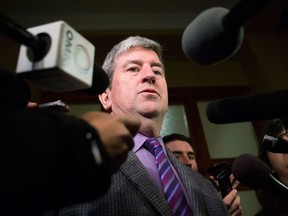 Glen Murray Ontario's Minister of Transportation, talks with media after Premier Kathleen Wynne was presented with the transit investment report by Anne Golden, chair of the transit investment strategy advisory panel, at Queens Park in Toronto on Thursday, December 12 2013. THE CANADIAN PRESS/Chris Young