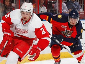 Florida's Jonathan Huberdeau, right, pursues Detroit's Brendan Smith at the BB&T Center on December 10, 2013 in Sunrise, Fla. (Joel Auerbach/Getty Images)